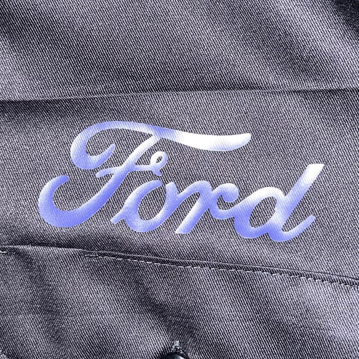 Close-up of reflective Ford script over chest pocket